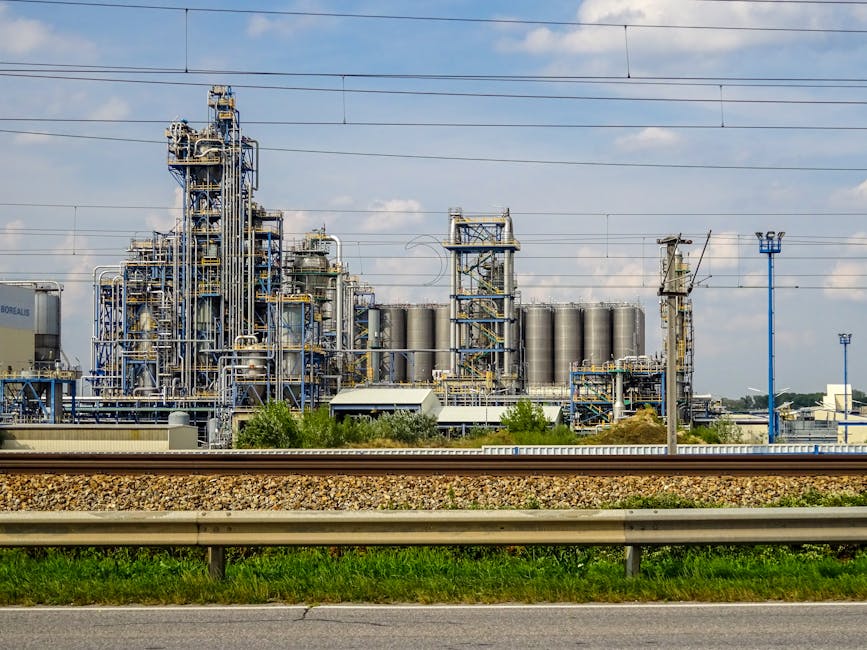 Large chemical plant exterior with industrial piping and process machinery