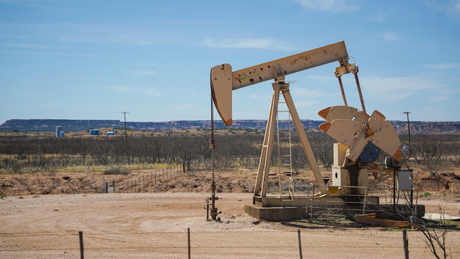 Oilfield pumpjack extracting crude under clear sky in the Permian Basin