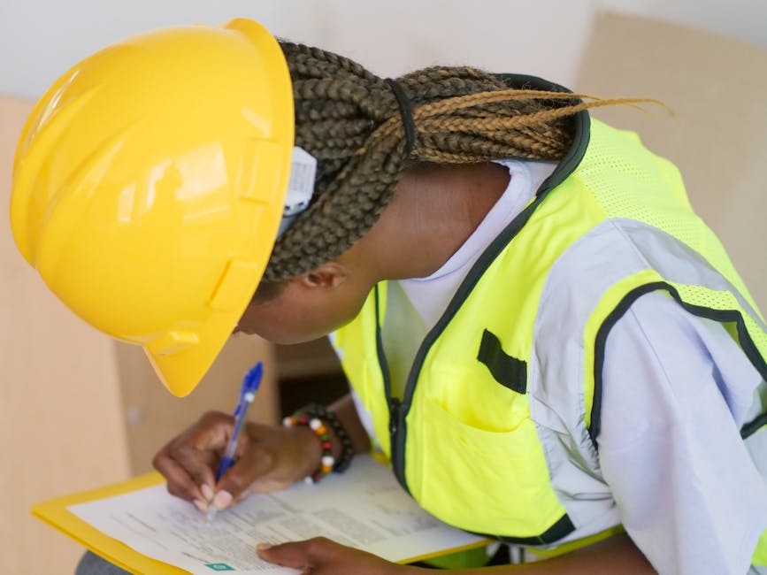 Construction inspector with hardhat and clipboard